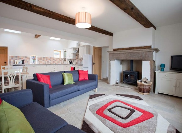 A large open plan living area leads to a fully equipped kitchen. A large open plan living area leads to a fully equipped kitchen.