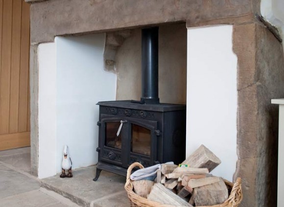 A traditional York stone floor and wood burning stove enhance this traditional cottage. A traditional York stone floor and wood burning stove enhance this traditional cottage.