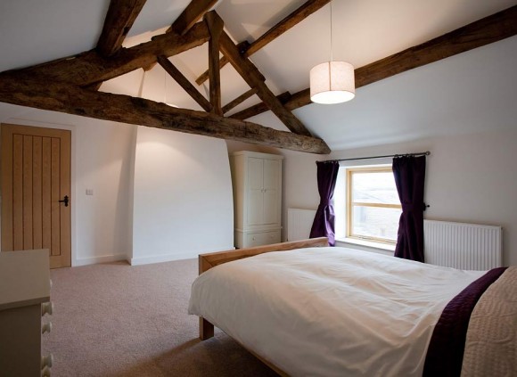 Bedroom showing feature oak beams.